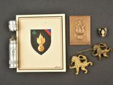 a lighter, lighter case, and other items on a table