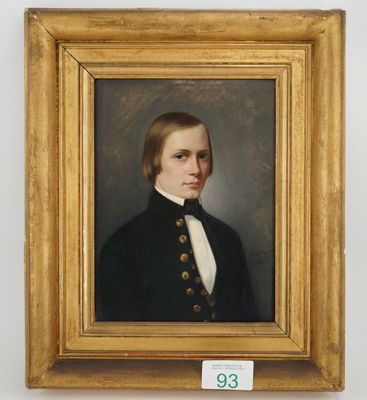 portrait of a young man in a black coat and white shirt