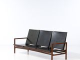 an image of two black leather seats on a white surface