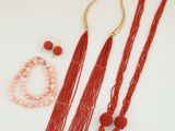 a group of jewelry including a necklace, bracelet, and ring