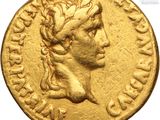 a gold coin with a woman ' s head on it
