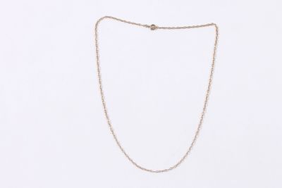 a gold chain necklace on a white background