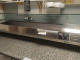 a counter top with a glass display case on it