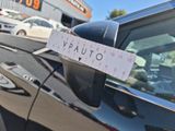 a parking ticket attached to the side of a car