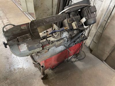 a machine that is sitting on a cart in a garage