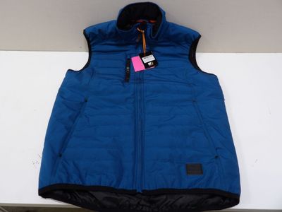 a close up of a blue vest hanging on a wall
