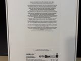 the back of a white box with a green label on it