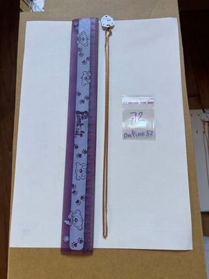 a ruler and a ruler on a table next to a piece of paper