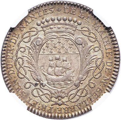 a close up of a coin with a ship on it