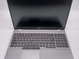 an open laptop computer sitting on top of a white table
