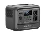 a close up of a radio with a clock on top of it