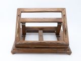 an old wooden magazine holder on a white surface with a white background
