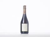 a bottle of wine that is sitting on a table
