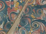 an open book with colorful designs on it