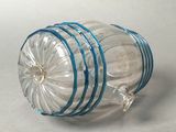 a clear glass jar with a blue stripe around it