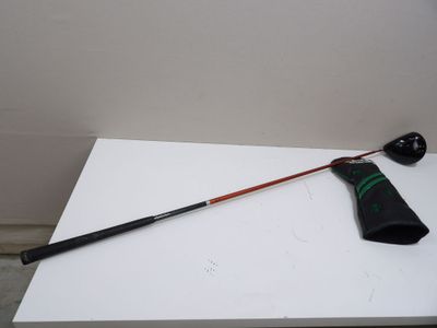 a black and green umbrella on a white table