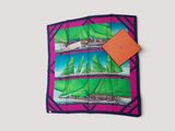 a square scarf with a picture of sailboats on it