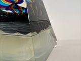 a glass pyramid with a multicolored design on it