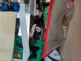 a cardboard box filled with christmas ornaments and other items