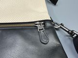 a black and white purse with a zipper on it