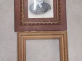 a picture of a woman that is hanging on the wall