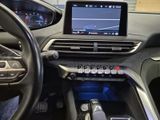 the interior of a car with a touch screen and steering controls