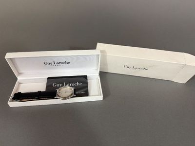the watch is in the box with the box open
