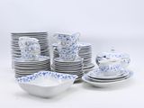 a lot of plates and cups on the table