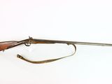 a rifle with a wooden barrel and a sling on a white background