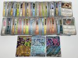 a lot of different pokemon cards on the table