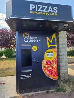 un distributeur automatique sur lequel est représentée une pizza