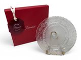 a clear glass plate with a red box and a tag
