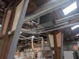 a large room with a lot of pipes and a ceiling