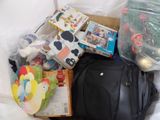 a bag of toys and other items on a bed