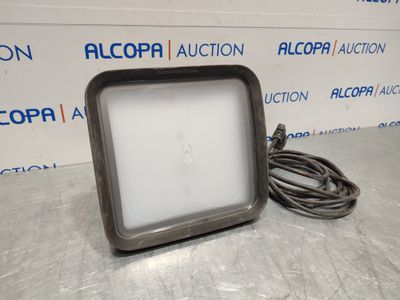 a close up of a light on a table with a cord