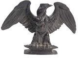 a statue of an eagle that is sitting on a table