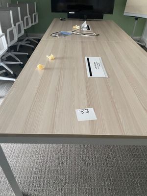 a long table with a number on it in a meeting room