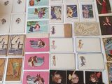 a lot of cards on the table with pictures on them