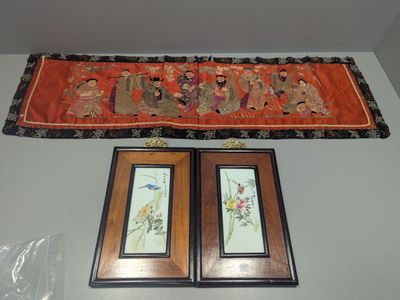 two framed pictures hanging on the wall next to each other
