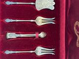 silverware in a velvet case with a red velvet lining