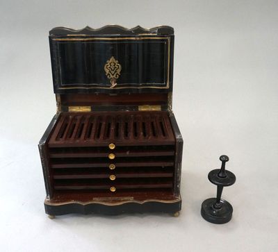 a small wooden box with a drawer on top of it