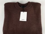 the sweater is brown and has a tag on it