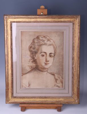 an old picture of a woman in a white dress is on a wooden easel
