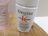 a bottle of kerastase next to a container of kerastase