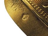 a close up of a gold ring with a design on it