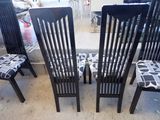 four chairs that are sitting next to each other