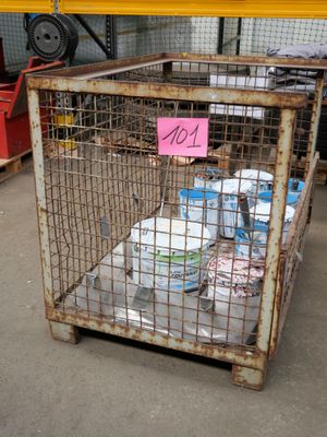 a cage with a lot of items inside of it