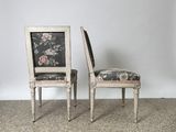 two chairs with floral upholstered back and upholstered seat