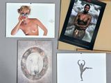 a lot of cards and a picture of a woman on the wall