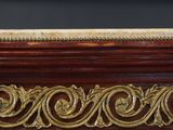 a close up of a marble top on a wooden table